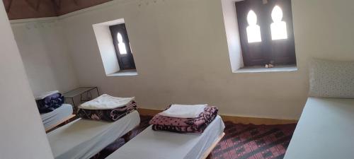 Postel nebo postele na pokoji v ubytování Gîte Assafar