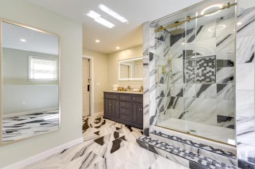 a bathroom with a walk in shower and a glass shower stall at Vibrant Westerly Home with Private Pool and Yard! in Westerly