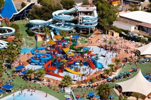 an aerial view of a water park with a water slide at Beau studio tout équipé dans le centre historique in Biot