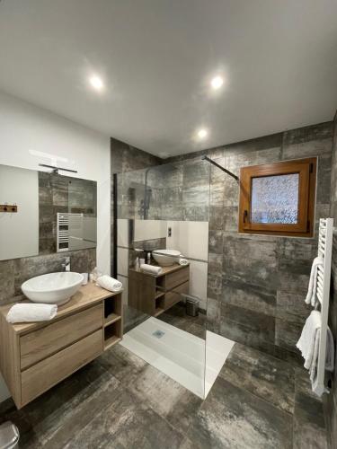 a bathroom with a sink and a mirror at Le Chalet Du Castor in Anould