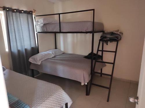 a couple of bunk beds in a room at Cabañas Hacienda Ridvan in Aguascalientes