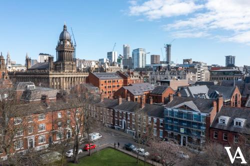 a view of a city with a clock tower at Velvet Apartments - 10 Park Square East in Leeds