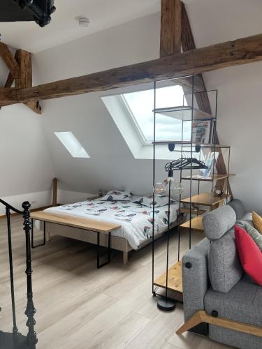 Ένα ή περισσότερα κρεβάτια σε δωμάτιο στο Le Loft de Flore