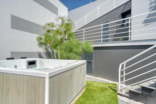 a hot tub in the backyard of a house at Studio 92, a Home in Madeira in Ponta do Sol
