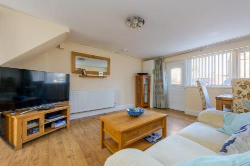 a living room with a large flat screen tv at Bradford on Avon in Bradford on Avon