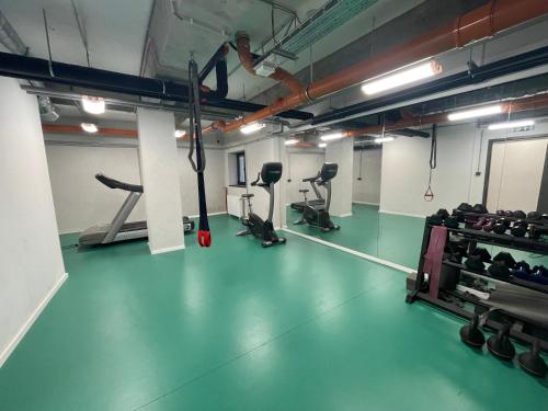 a gym with a person doing a jump in the air at Design Boutique INBP110 Studio Apartment #freeparking in Budapest