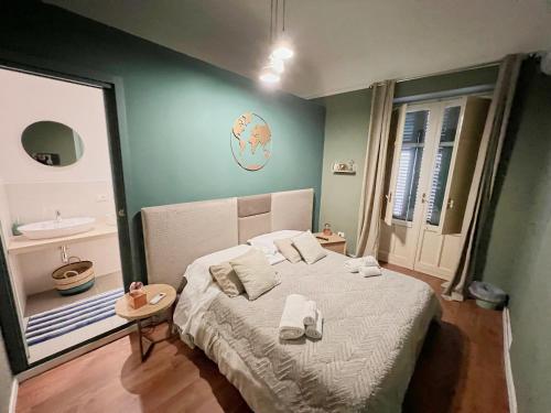 a bedroom with a bed with towels on it at Residenza del Castillo in Palermo