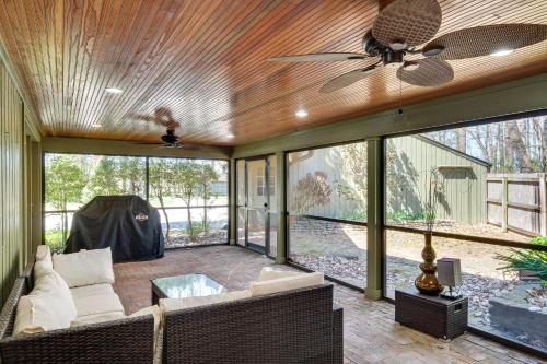 a living room with a ceiling fan and a couch at Spacious Prospect Cottage with Deck and Scenic Views in Prospect