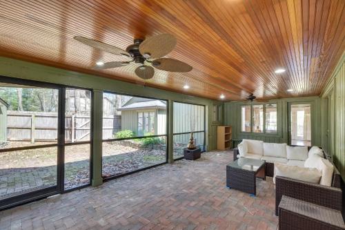 a living room with a ceiling fan and a couch at Spacious Prospect Cottage with Deck and Scenic Views in Prospect