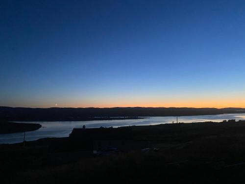 a view of a body of water at sunset at Sgothan Dearg in Portree