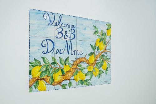 a sign with a lemon tree with the words welcome brother dad mum at B&B DieMme Amalfi Coast in Vietri sul Mare