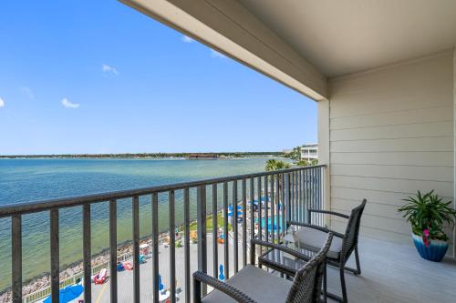 a balcony with chairs and a view of the beach at Sunset Paradise - Find yourself in Tampa in Tampa