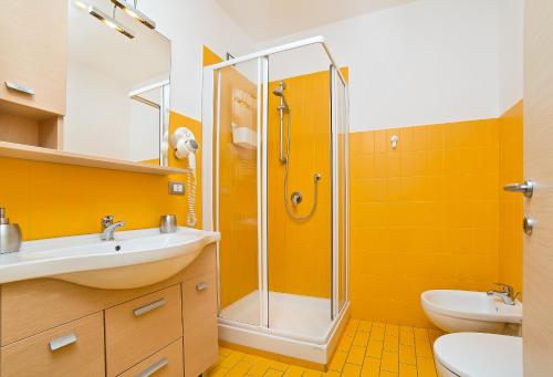 a bathroom with a shower and a sink at De Maria House in SantʼAgata sui Due Golfi
