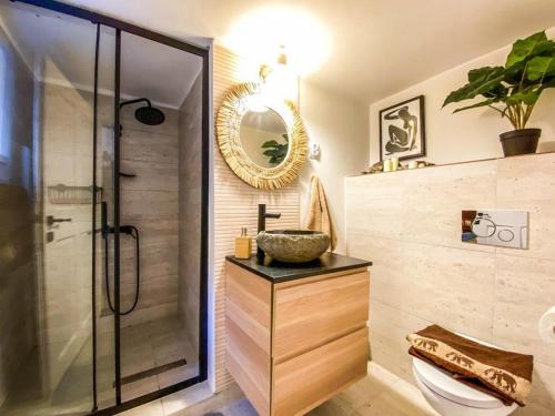 a bathroom with a shower and a sink and a mirror at Yellow studio in Cluj-Napoca