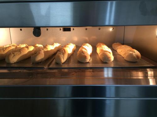 a group of loaves of bread in an oven at Johanneshof Gästehaus in Hockenheim