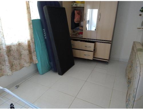 a kitchen with a refrigerator in a room at Apartamento recreio in Rio de Janeiro