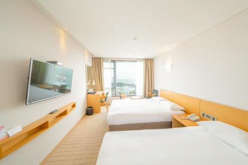 Postel nebo postele na pokoji v ubytování Mstay Hotel