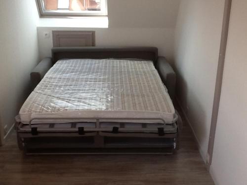En eller flere senge i et værelse på Appartement Villers-sur-Mer, 1 pièce, 2 personnes - FR-1-712-12