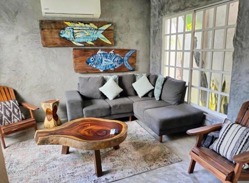 a living room with a couch and a table at San MARTÍN in Cozumel