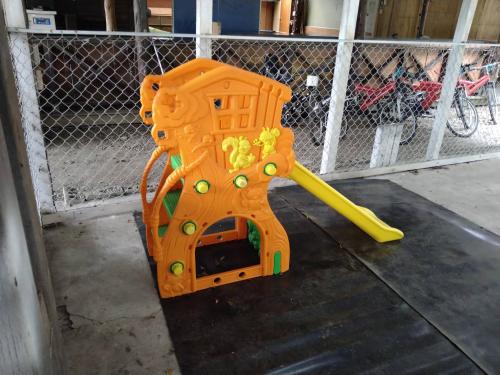 a childs play equipment with a yellow bat at Master Bear Resort in Jiafeng