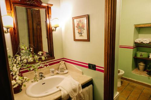 a bathroom with a sink and a toilet at Podere Costa Romana in Narni