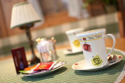 a cup of tea sitting on top of a table at Hotel Gianna in Madonna di Campiglio
