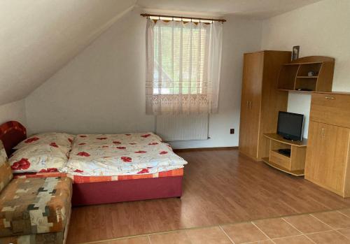 Ένα ή περισσότερα κρεβάτια σε δωμάτιο στο Apartmány u Samuela