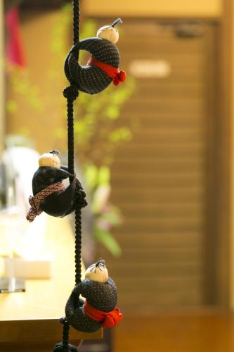 a group of birds perched on a rope at Super Hydrogen Rich Spa Yado Kanzan in Minakami
