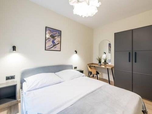 Ferrata Apartamenty Zakopaneにあるベッド