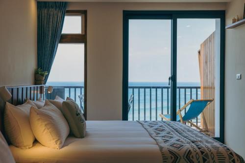 Postel nebo postele na pokoji v ubytování Chuanfanrock Haku Beach Days Inn