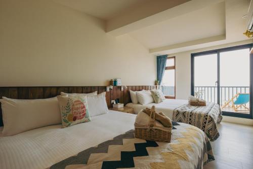 Chuanfanrock Haku Beach Days Innにあるベッド