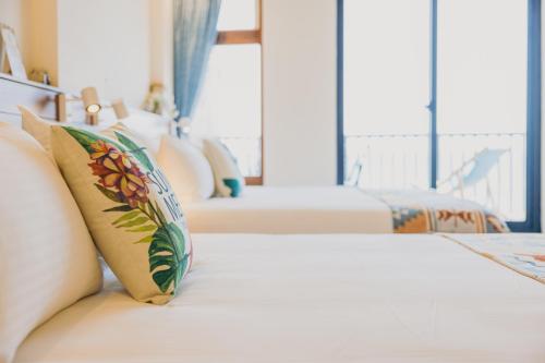 Chuanfanrock Haku Beach Days Innにあるベッド
