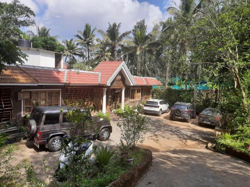 a truck parked in front of a house at Sopanam Heritage Thekkady in Thekkady