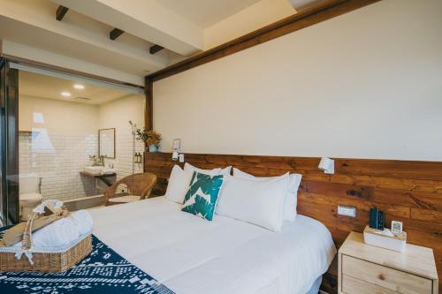 Chuanfanrock Haku Beach Days Innにあるベッド