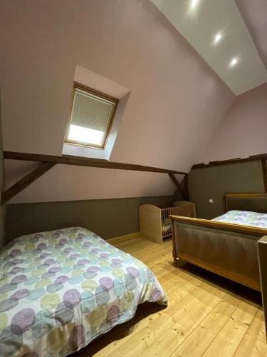 Ένα ή περισσότερα κρεβάτια σε δωμάτιο στο Auberge des Sauterelles