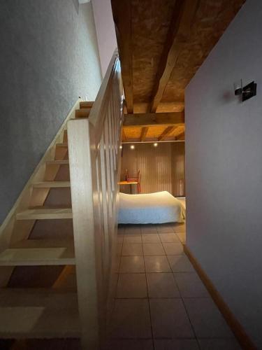 Ένα ή περισσότερα κρεβάτια σε δωμάτιο στο Auberge des Sauterelles