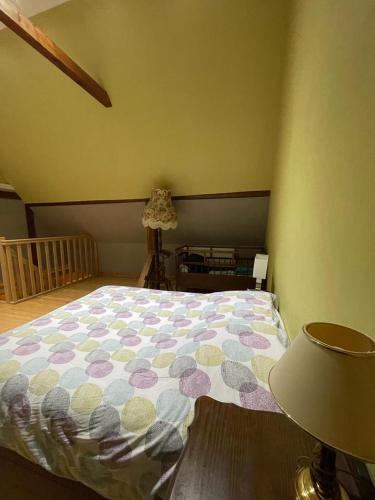 Ένα ή περισσότερα κρεβάτια σε δωμάτιο στο Auberge des Sauterelles