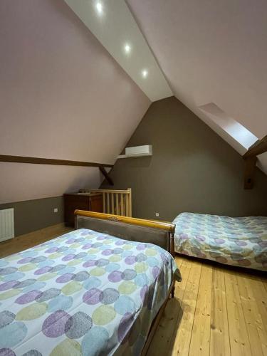 Ένα ή περισσότερα κρεβάτια σε δωμάτιο στο Auberge des Sauterelles