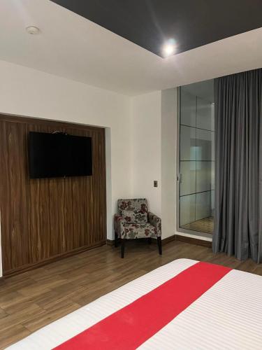 TV a/nebo společenská místnost v ubytování Zújmú Business Boutique Hotel
