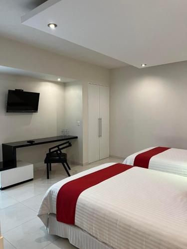 Postel nebo postele na pokoji v ubytování Zújmú Business Boutique Hotel
