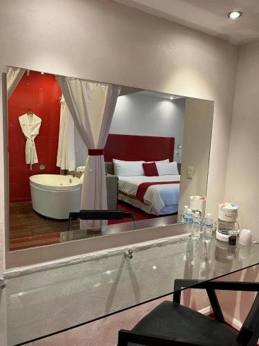 Postel nebo postele na pokoji v ubytování Zújmú Business Boutique Hotel