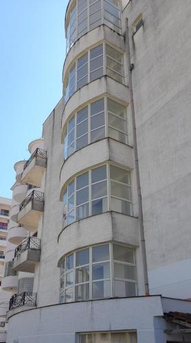 a tall building with windows on the side of it at Vila Melisa in Durrës