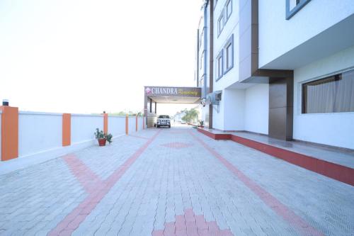 an empty corridor of a building with a parking lot at Chandra Residency in Dharmapuri