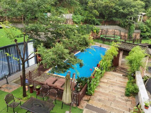 an overhead view of a swimming pool in a backyard at Wild House in Deqing