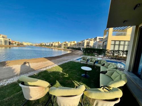a balcony with chairs and a view of the water at tawila T 31 in Hurghada