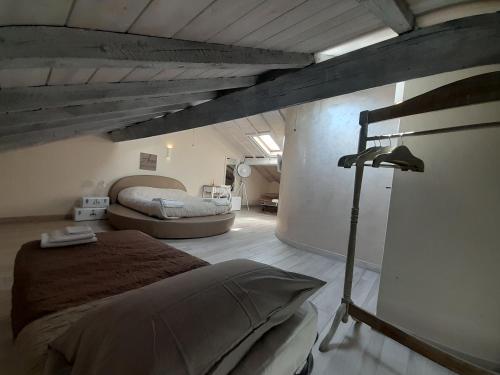 a bedroom with a large bed in a room at AMA AFFITTACAMERE in Albenga