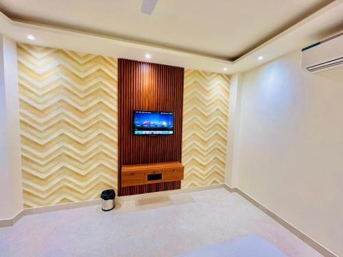 TV a/nebo společenská místnost v ubytování Hotel RIVERB