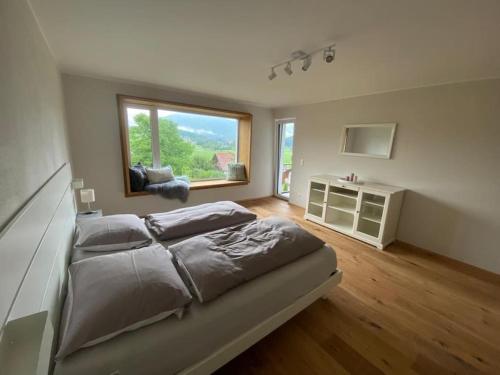 a bedroom with a large bed and a window at Mountain View Lodge in Bergen