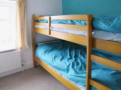 a couple of bunk beds in a room at Shoreline in Sandown