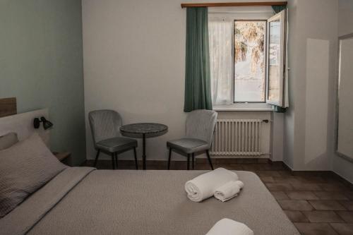 Ένα ή περισσότερα κρεβάτια σε δωμάτιο στο Albergo Ristorante Al Portico